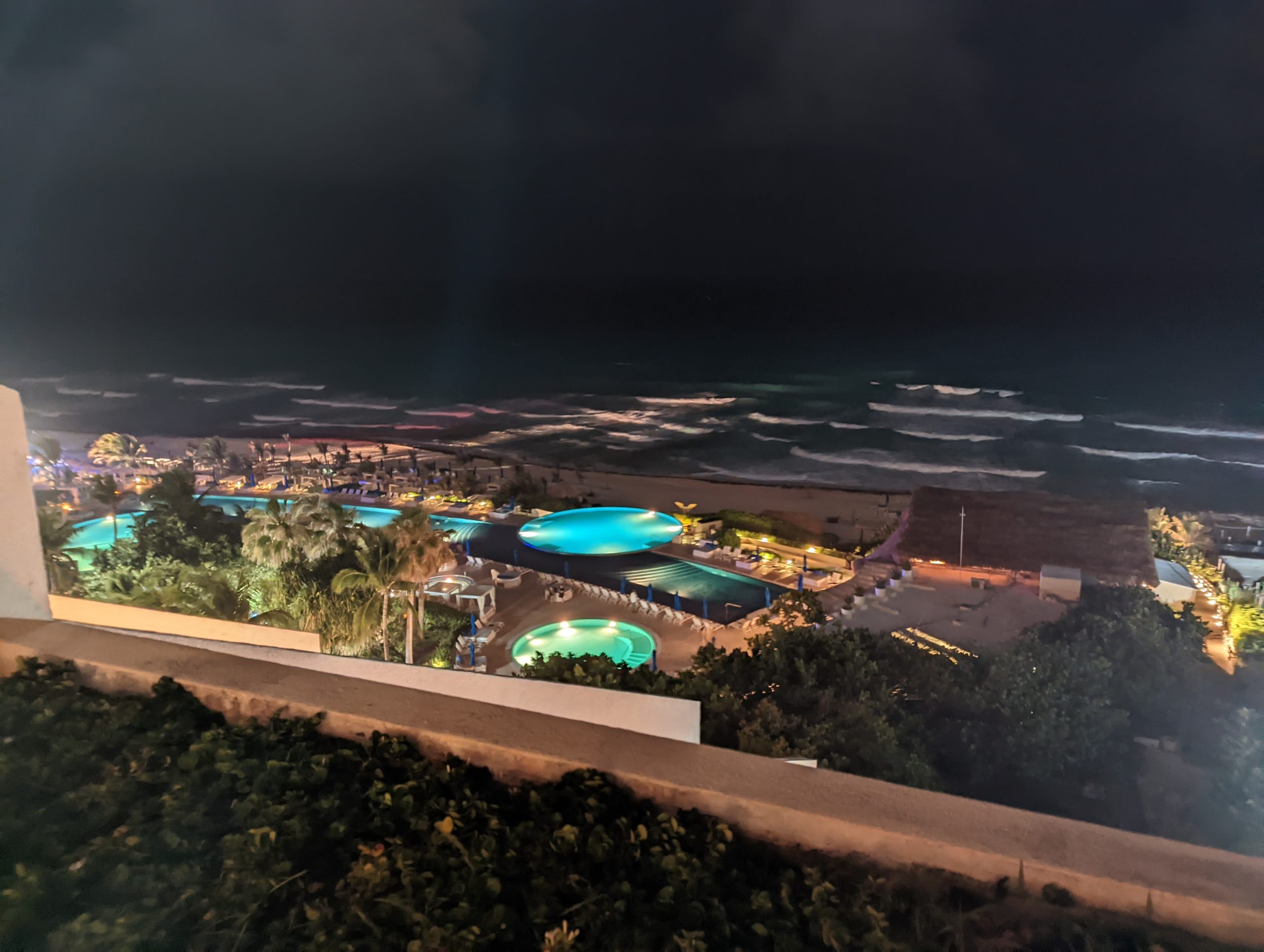 Image of resort in Mexico overlooking pool and ocean.